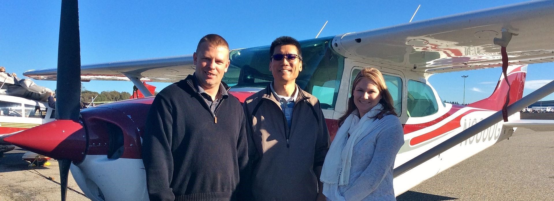 Sunshine Flyers CFI Jeremy Larson (left) with new pilot Troy Tetsuka and DPI Ashley Snider